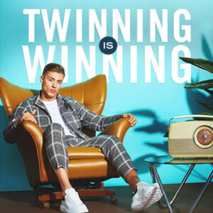 Boohoo 'Twinning is Winning' campaign — bold typographic poster with male model seated against teal background